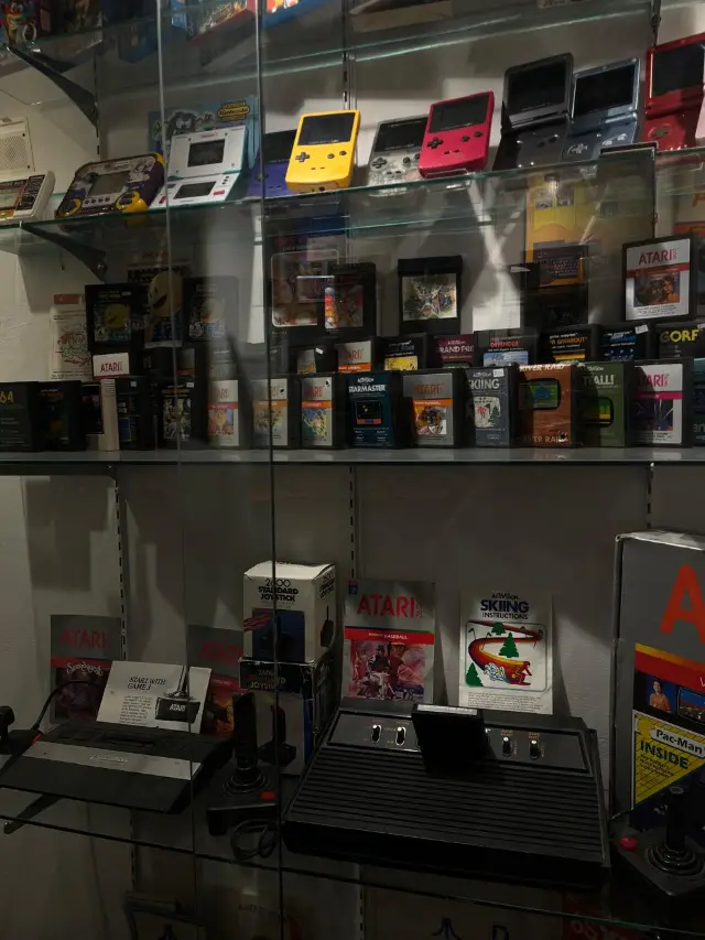 Retro consoles and Game Boys on the shelves of the Taybeen Museum
